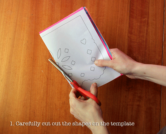 Make papel picado - cutting a paper picados using scissors for Day of the Dead!