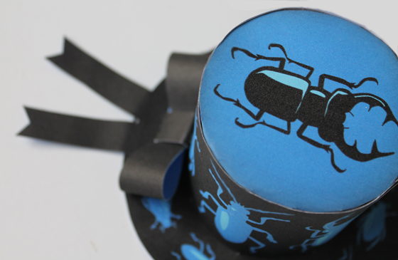 Halloween bugs mini paper top hats with a cute bow and crawly bug on top