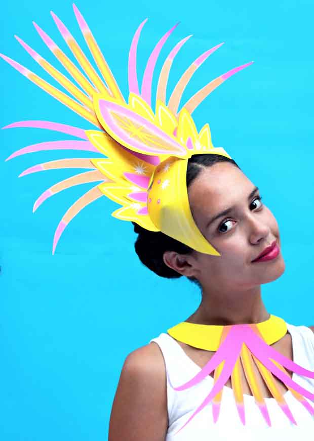 Sofia wearing a paper carnival headdress 