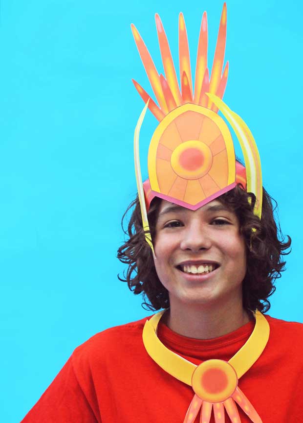 Akira wearing a paper carnival headdress 